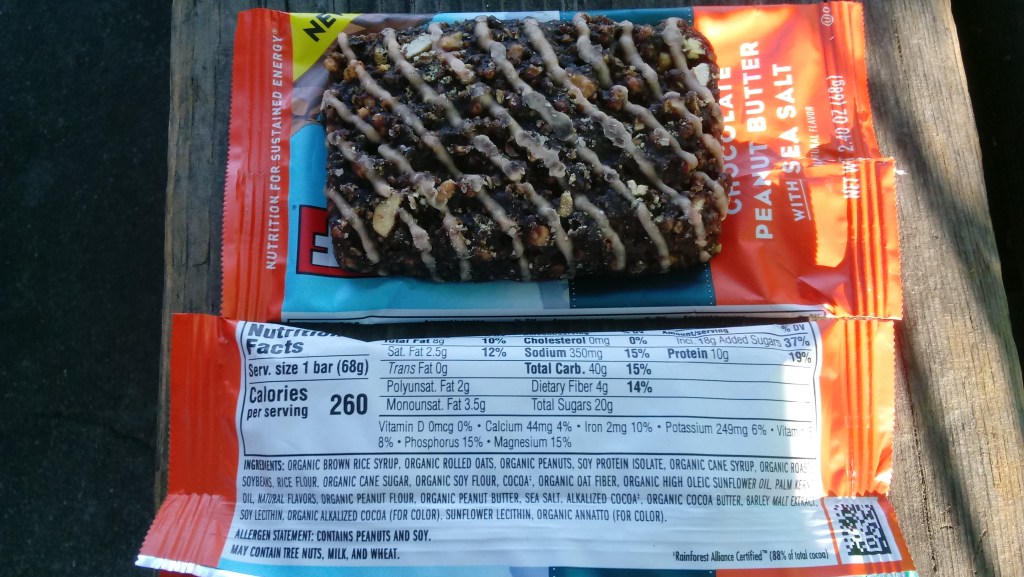 Clif Bars – sustainability and ethical review. A photo of Clif's Chocolate Peanut Butter bar from Cliff’s Sweet and Salty range, together with the wrapper, showing the ingredients and nutritional info.