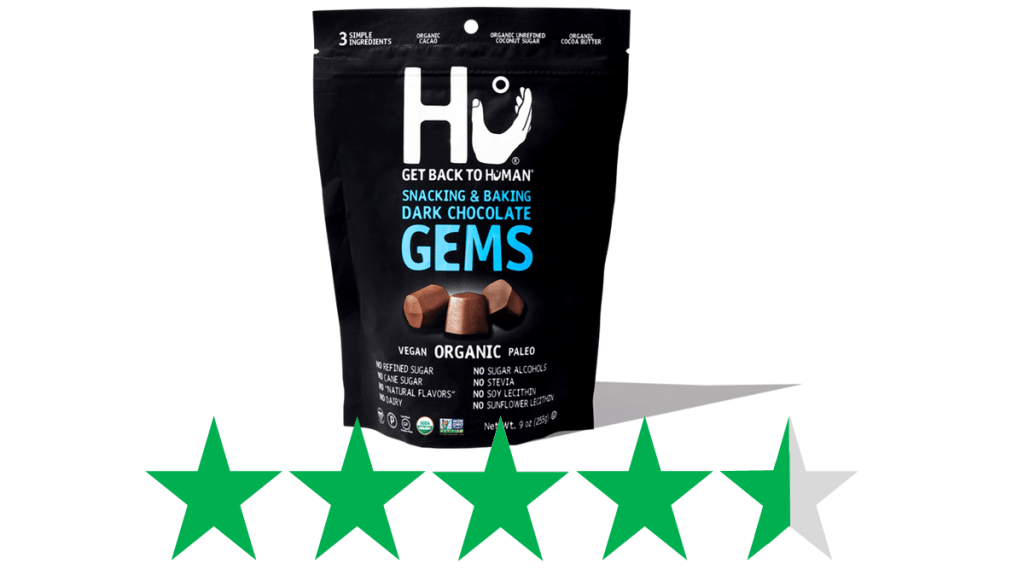 A bag of Hu Dark Chocolate Gems is pictured above a graphic showing an ethical score of 4.5/5 Green Stars for social and environmental impact. 