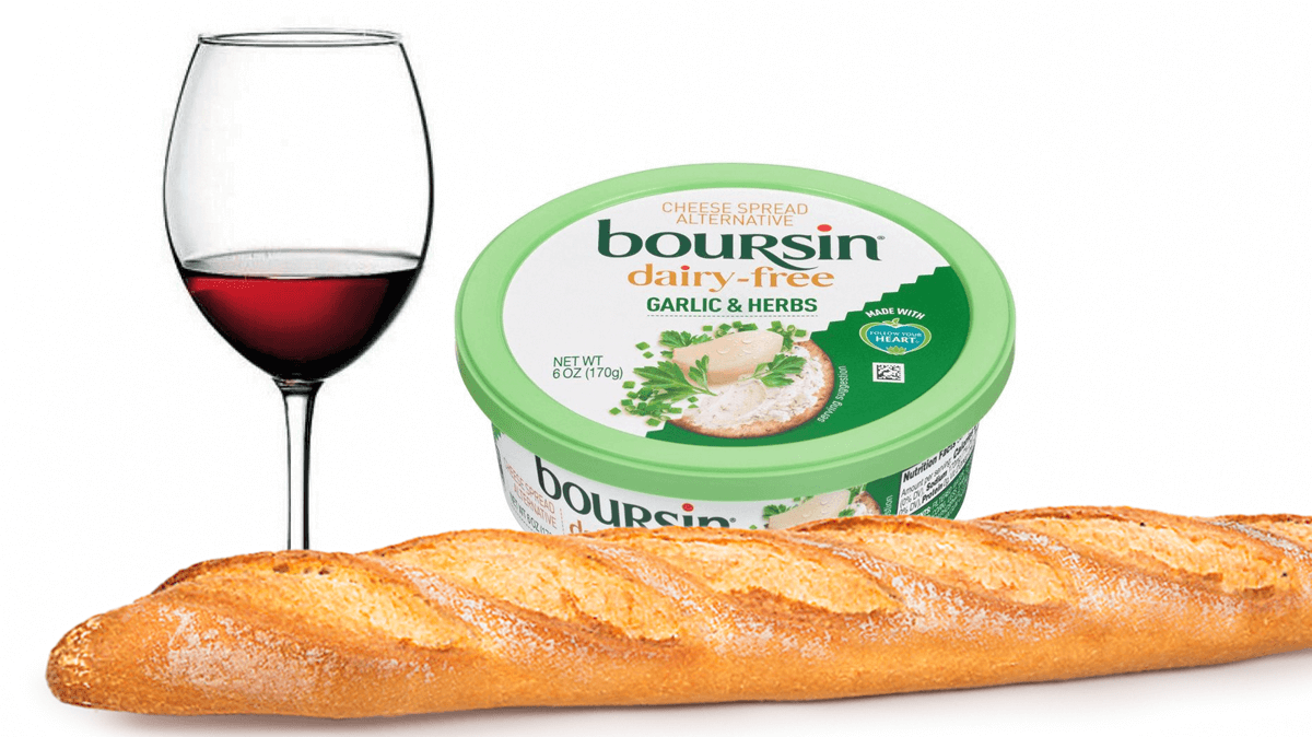 The image shows a glass of red wine, a baguette, and a tub of dairy-free Boursin cheese. It's loosely based on an old Boursin advertisement that came with the tagline:
Du pain, du vin, du Boursin