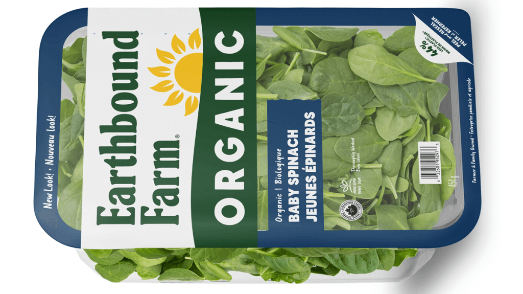 A picture of a box of Earthbound Farm organic baby spinach with messaging that the improved packaging uses 44 percent less plastic. The plastic was saved by replacing a hard lid with a peel and reseal lid. 