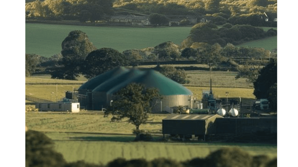 Anaerobic digesters pictured among green fields and hedges at Wkye Farms, makers of Ivy's Reserve butter and cheese. 